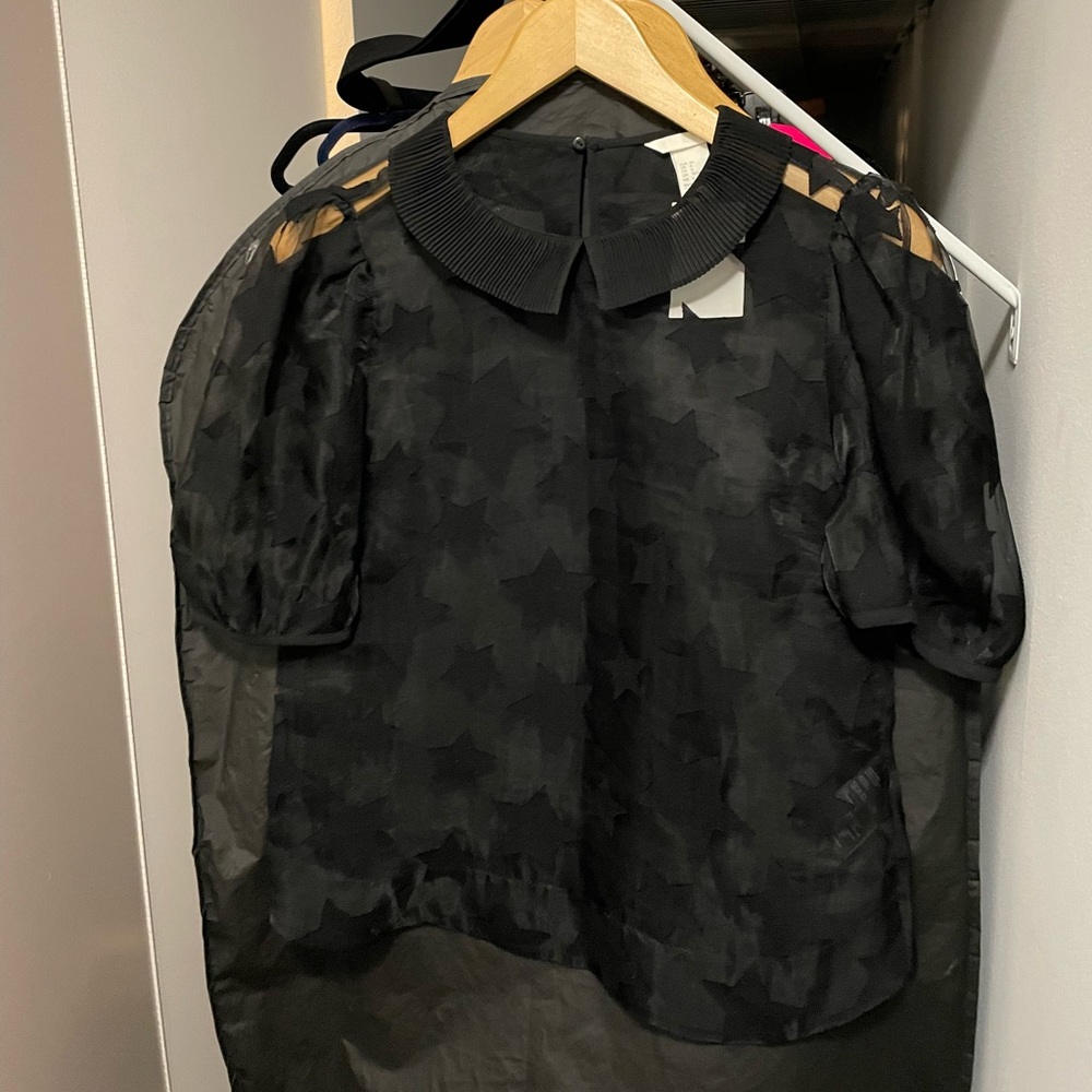 Collared see through star black top